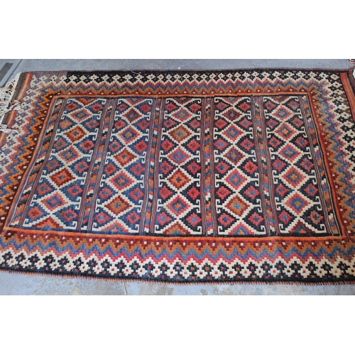 60C - Kelim rug with a panelled polychrome design, 6ft 4ins x 4ft 2ins approximately