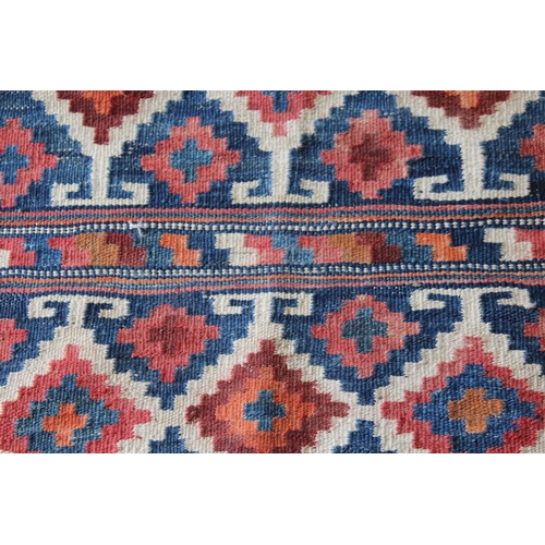 60C - Kelim rug with a panelled polychrome design, 6ft 4ins x 4ft 2ins approximately