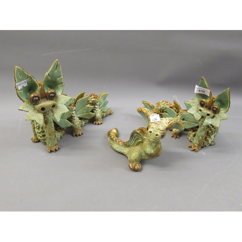 630 - Two large Yare pottery figures of dragons, together with a similar figure of a baby dragon, the larg... 