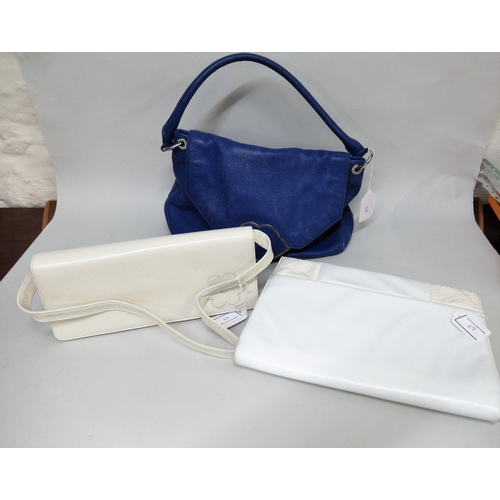 69 - Lulu Guinness, blue leather handbag with dust bag, together with a Harrods white shoulder bag (at fa... 