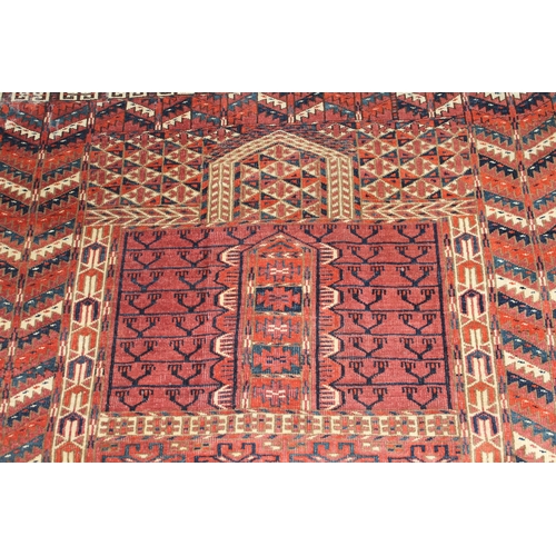 7 - Turkoman prayer rug with a twin panel Mihrab design on a wine ground with borders and skirt panel, 4... 