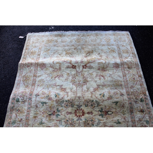 8 - Afghan Ziegler type rug with an all-over palmette and floral design on an ivory ground with borders,... 