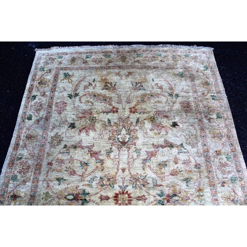 8 - Afghan Ziegler type rug with an all-over palmette and floral design on an ivory ground with borders,... 