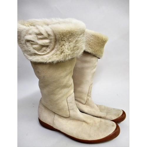 83 - Pair of ladies Gucci fur lined suede boots, together with dust bag