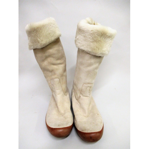 83 - Pair of ladies Gucci fur lined suede boots, together with dust bag