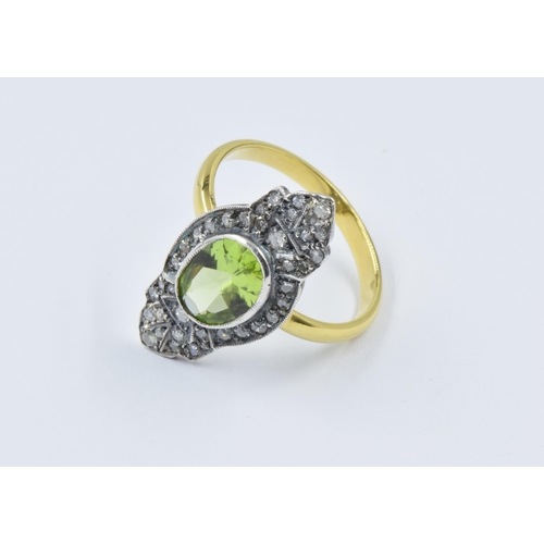 918 - Yellow gold dress ring set with a central oval peridot surrounded by rose cut diamonds, unmarked,  s... 