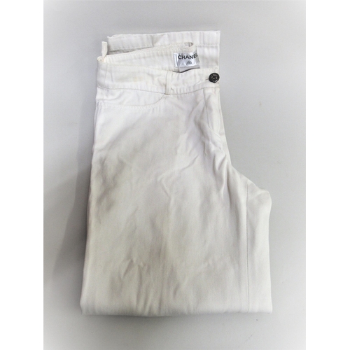 94 - Chanel, pair of ladies white jeans, size 36 together with a Chanel navy blue skirt with buttons in t... 