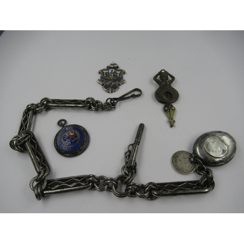 980 - Antique steel Albert chain, silver and enamel medallion, another medallion and a novelty cigar cutte... 