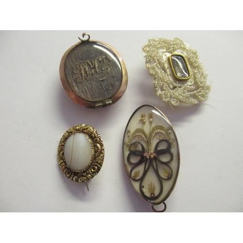 912 - Three various Georgian memorial brooches, together with a similar mother of pearl leaf form brooch