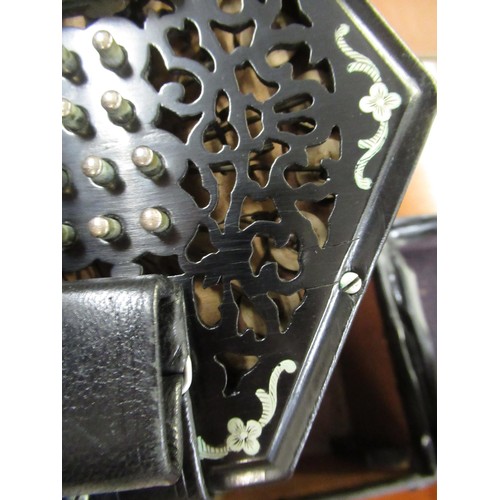 131 - Wheatstone & Co. forty eight button concertina, the pierced ebony end caps with engraved steel inlay... 