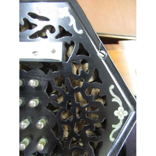 131 - Wheatstone & Co. forty eight button concertina, the pierced ebony end caps with engraved steel inlay... 