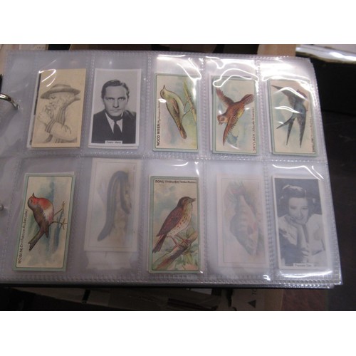 148 - Four albums containing various cigarette card odds including Wills, mainly non sport subjects