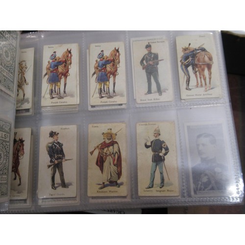 148 - Four albums containing various cigarette card odds including Wills, mainly non sport subjects