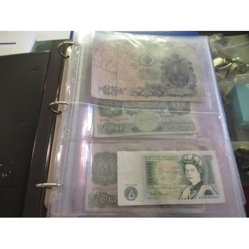 974 - Two albums containing a large quantity of various British and World bank notes, together with a bag ... 