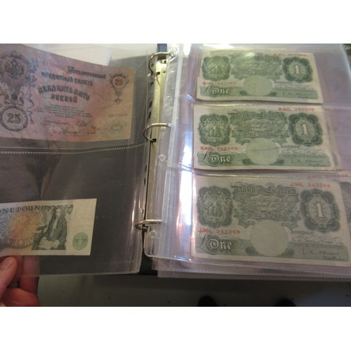 974 - Two albums containing a large quantity of various British and World bank notes, together with a bag ... 