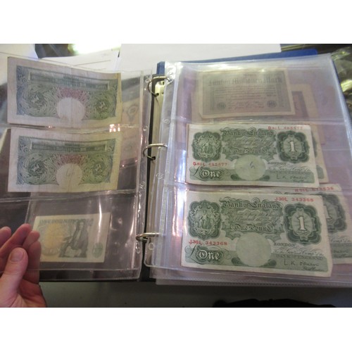 974 - Two albums containing a large quantity of various British and World bank notes, together with a bag ... 