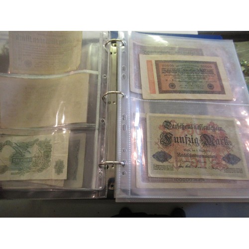 974 - Two albums containing a large quantity of various British and World bank notes, together with a bag ... 