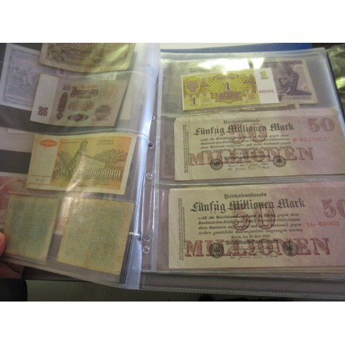 974 - Two albums containing a large quantity of various British and World bank notes, together with a bag ... 