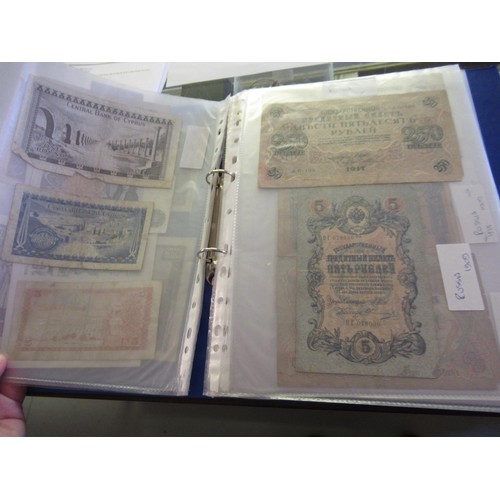 974 - Two albums containing a large quantity of various British and World bank notes, together with a bag ... 