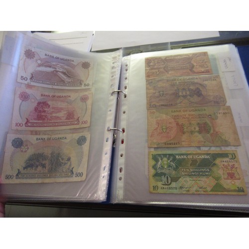 974 - Two albums containing a large quantity of various British and World bank notes, together with a bag ... 