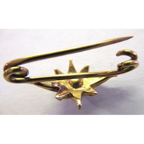 909 - Miniature yellow metal and rose cut diamond set star form brooch, overall width 25mm approximately