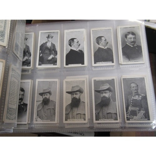 148 - Four albums containing various cigarette card odds including Wills, mainly non sport subjects