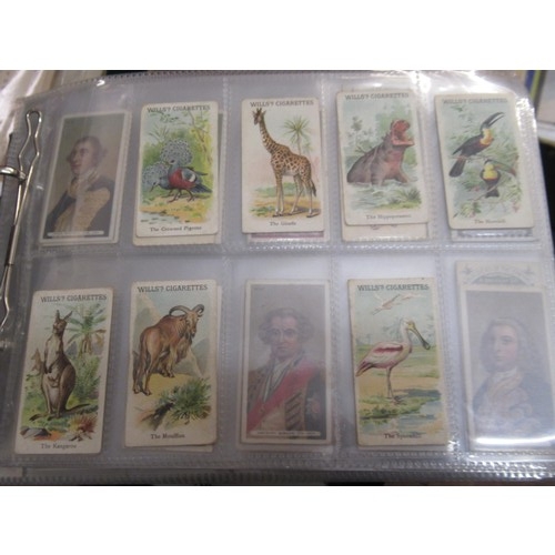 148 - Four albums containing various cigarette card odds including Wills, mainly non sport subjects