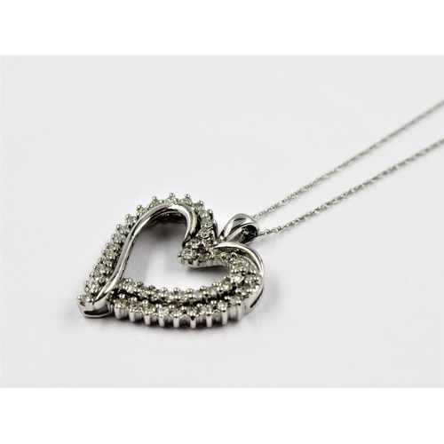 1340A - 10ct White gold diamond set heart shaped pendant on a 10ct white gold chain