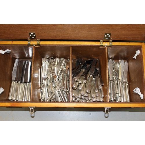 1034 - Four wooden crates containing a large collection of various silver plated cutlery