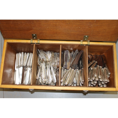 1034 - Four wooden crates containing a large collection of various silver plated cutlery