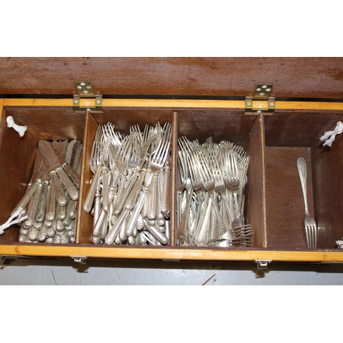 1034 - Four wooden crates containing a large collection of various silver plated cutlery