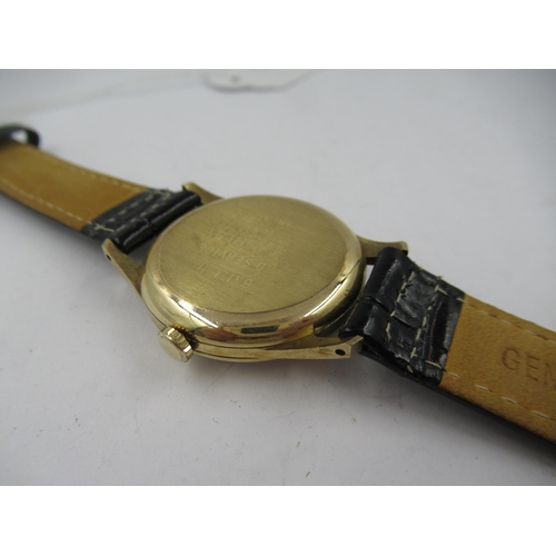 1111 - Gentleman's 9ct gold cased wristwatch by Garrards, the silvered dial with Arabic and baton numerals,... 