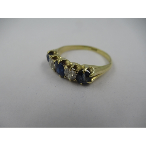 1114 - 18ct Yellow gold five stone sapphire and diamond half hoop ring, size O