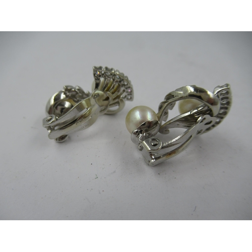 1116 - Pair of 14ct white gold cultured pearl and diamond set clip earrings of stylised floral design, appr... 