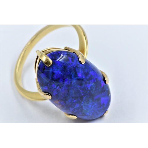 1139 - High carat yellow metal and black opal claw set ring, circa 1970's, the oval stone approximately 23 ... 