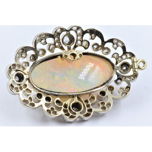 1141 - Large fire opal and diamond set pendant, the shaped pierced surround set old and rose cut stones, th... 