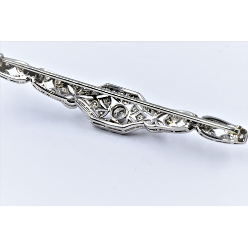 1142 - High carat white metal and diamond set bar brooch of Art Deco design, set with a variety of brillian... 