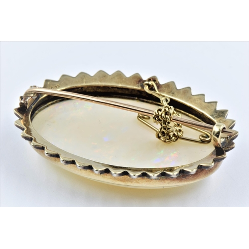 1143 - Very large opal and rose cut diamond brooch, the oval opal approximately 38mm x 25mm