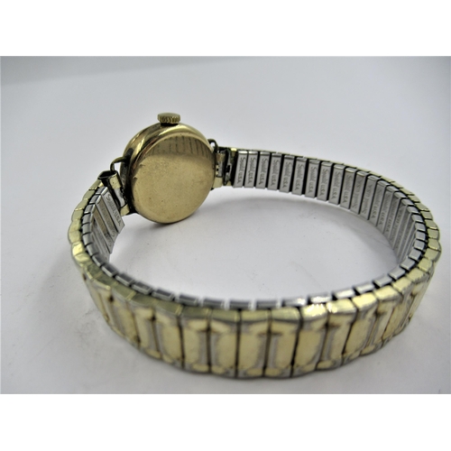 1177 - 9ct Yellow gold ladies wristwatch with later gold plated strap