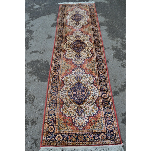 12 - Modern machine woven rug of Persian design with a triple medallion on a rose ground with borders, 8f... 