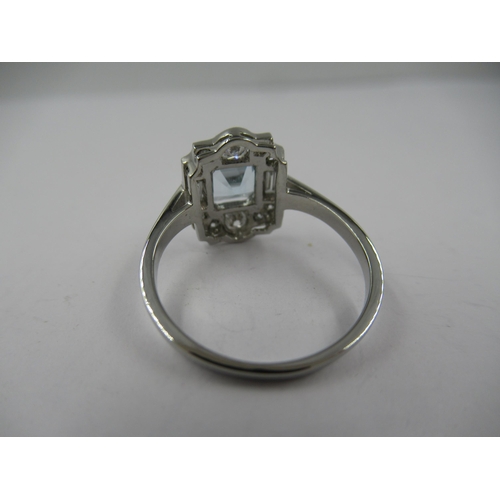 1200 - Platinum Deco style ring set square aquamarine surrounded by diamonds, size N