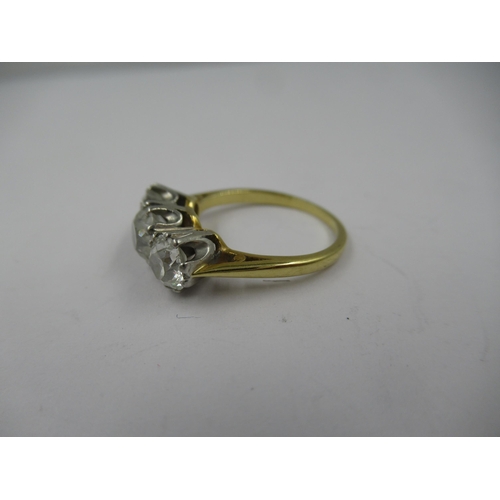 1252 - 18ct Gold and platinum three stone old cut diamond ring, the centre stone of approximately 0.5ct, fl... 