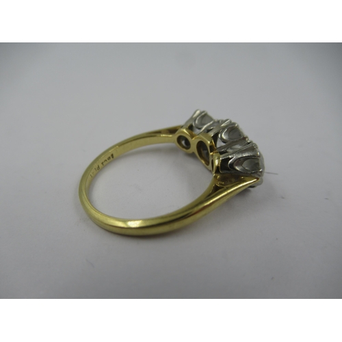 1252 - 18ct Gold and platinum three stone old cut diamond ring, the centre stone of approximately 0.5ct, fl... 