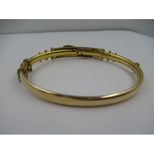 1253 - Edwardian 15ct gold and diamond set bangle, interior dimensions 60 x 50mm, 9.2gms