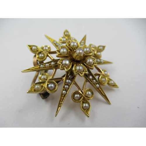 1254 - Victorian unmarked yellow metal and split pearl set star form pendant/brooch, 31mm diameter, 6.2gms