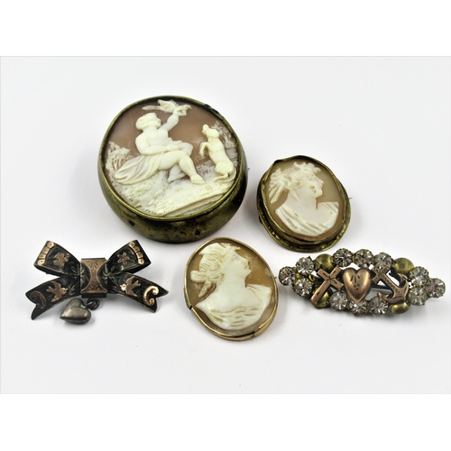 1289 - Three 19th Century carved shell cameo brooches together with two other 19th Century brooches