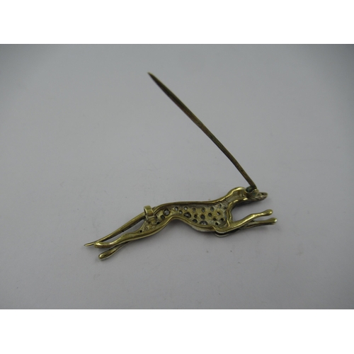 1306 - 9ct Yellow gold and silver mounted brooch in the form of a greyhound set rose cut diamonds