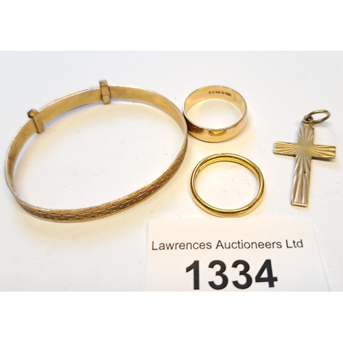 1334 - 22ct Gold wedding band, 2.5g, together with a 9ct gold wedding band and a 9ct gold pendant cross, 3.... 