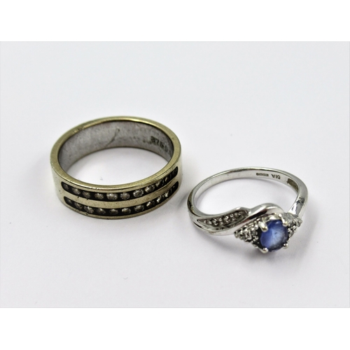 1335 - 9ct White gold sapphire and diamond crossover ring, together with a 9ct white gold & diamond channel... 