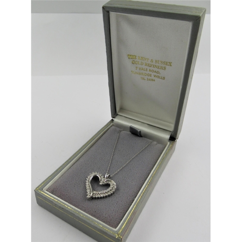 1340A - 10ct White gold diamond set heart shaped pendant on a 10ct white gold chain